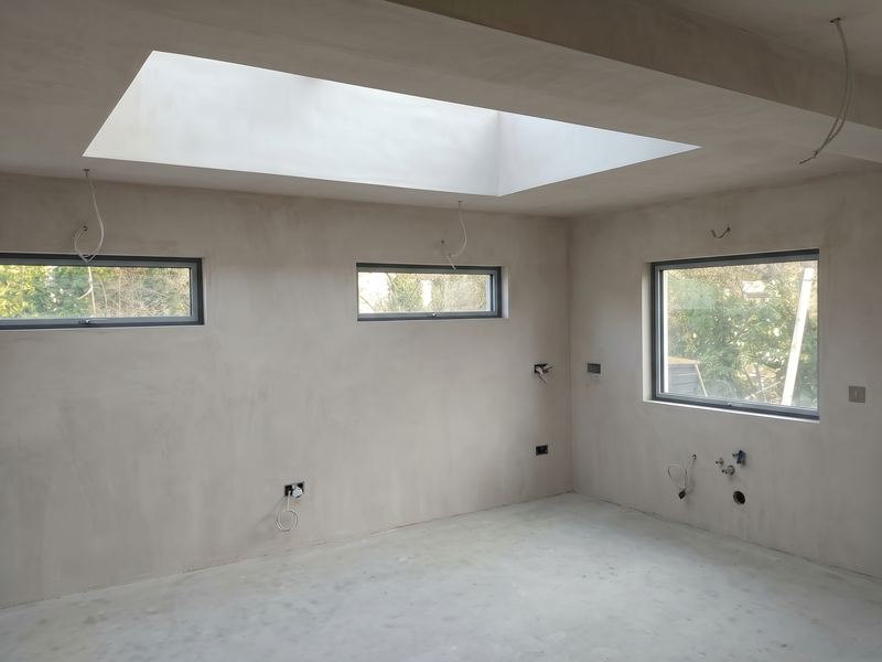 Freshly plastered interior with a large rooflight
